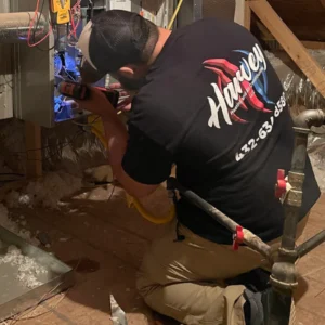 HVAC Tech Repairing Unit